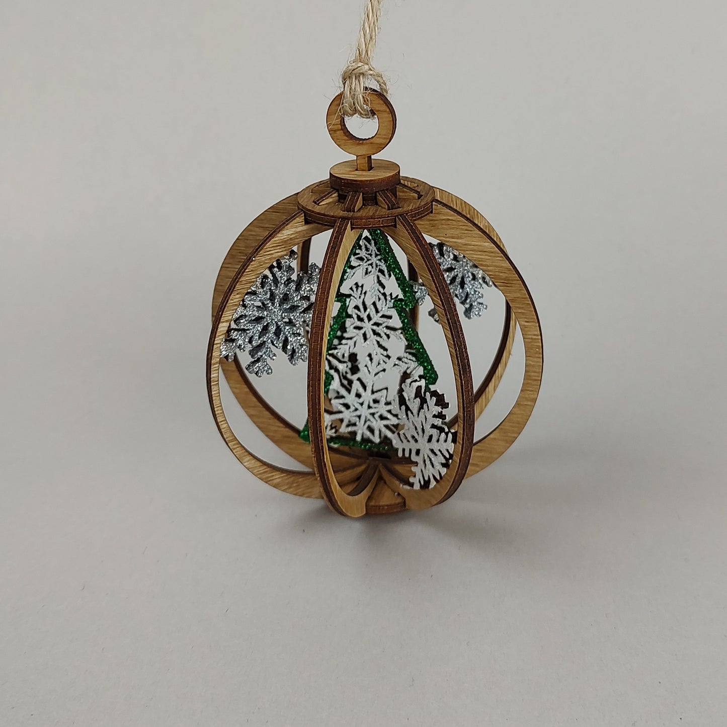 White with green tree globe ornament